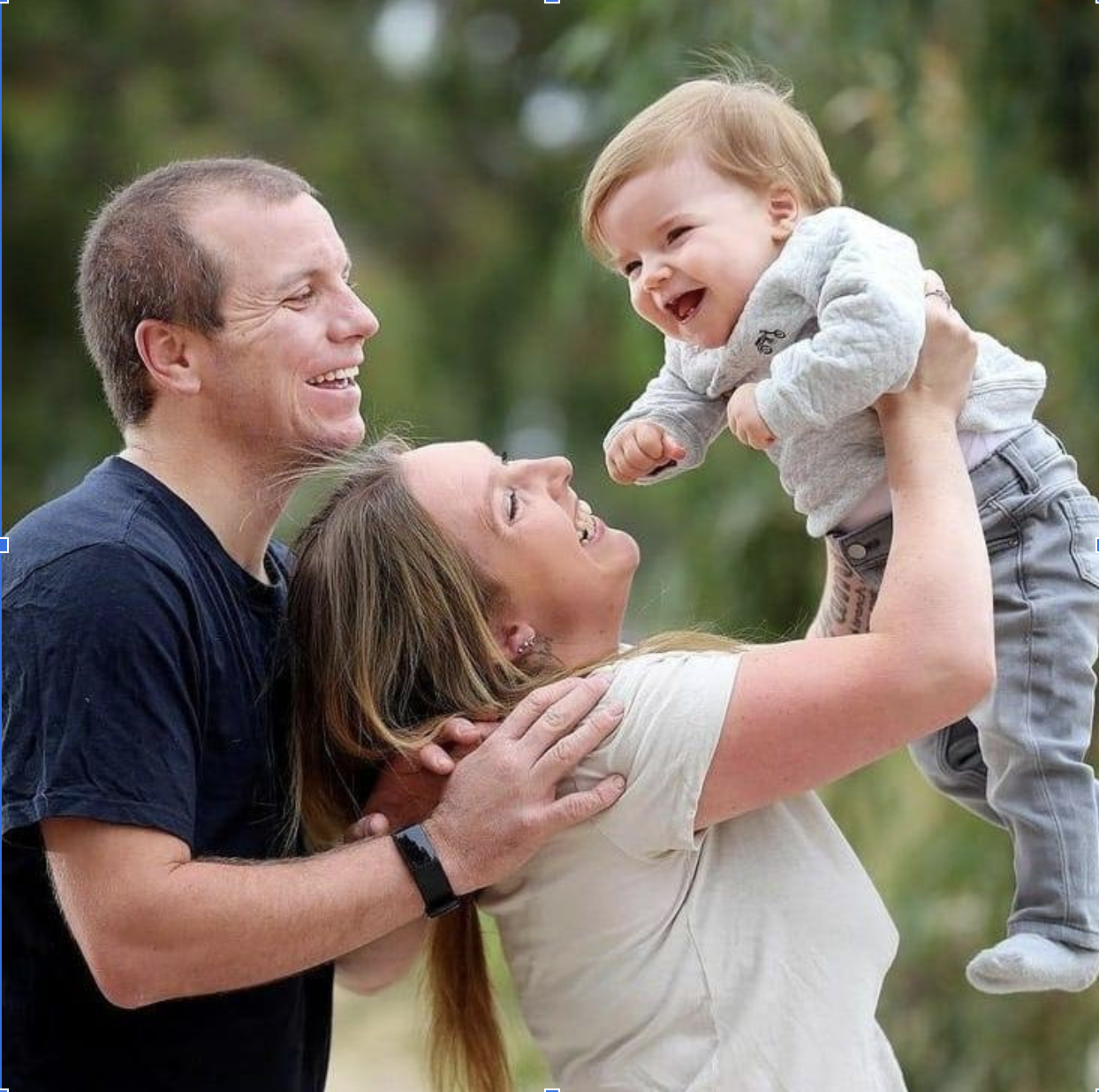 A KCNQ2 parent smiling with their child